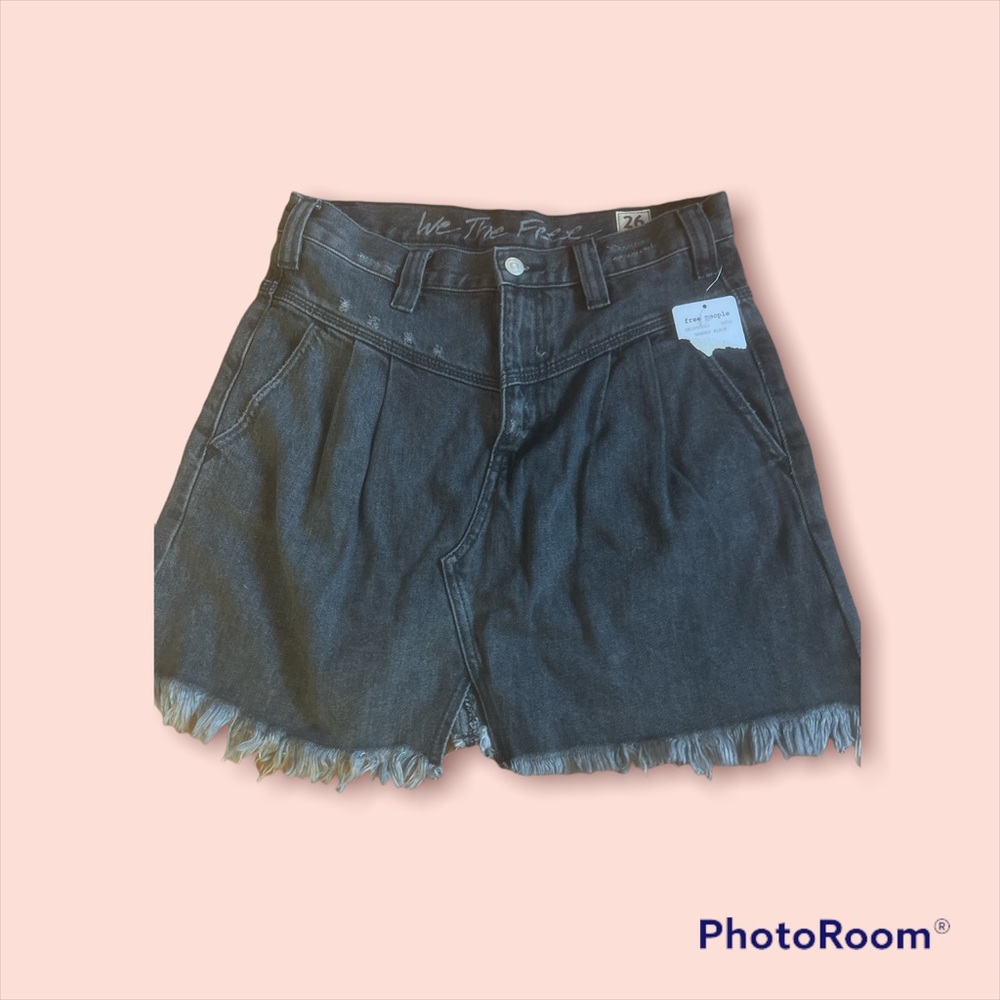 This is a a we the free mini denim skirt in sanded black color
